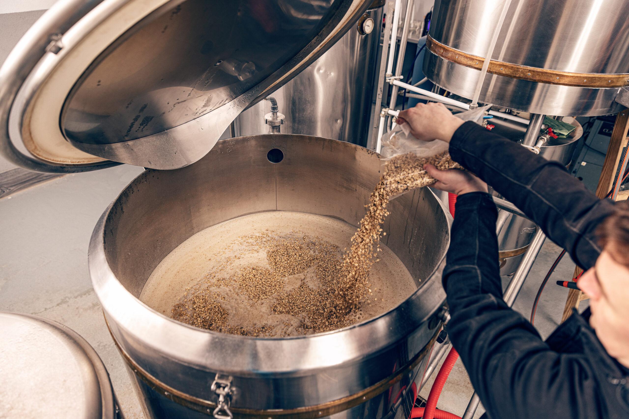 worker pours ingredients 2023 11 27 05 25 20 utc scaled Clayton Industries – Advanced Steam Boiler Technology