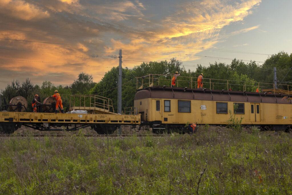 industrial railway train with construction workers 2023 11 27 04 53 23 utc scaled Clayton Industries – Advanced Steam Boiler Technology