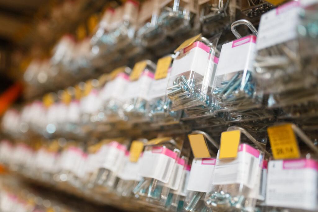 rows of boxes with bolts in hardware store closeup 2023 11 27 05 10 23 utc scaled Clayton Industries – Advanced Steam Boiler Technology